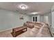 Finished basement with neutral carpet, light-blue walls, and a comfortable sectional at 639 Oak Moss Dr, Lawrenceville, GA 30043