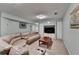 Spacious basement living area featuring a large sectional sofa and built-in entertainment center at 639 Oak Moss Dr, Lawrenceville, GA 30043