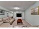 Spacious basement living area featuring a large sectional sofa and built-in entertainment center at 639 Oak Moss Dr, Lawrenceville, GA 30043