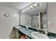 Bathroom featuring double vanity and glass-enclosed shower at 639 Oak Moss Dr, Lawrenceville, GA 30043