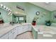 Large bathroom with double sinks, a soaking tub, and unique lighting fixtures at 639 Oak Moss Dr, Lawrenceville, GA 30043