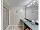 Bathroom featuring single vanity and glass-enclosed shower at 639 Oak Moss Dr, Lawrenceville, GA 30043