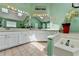 Bathroom featuring double sinks, a large mirror, and natural lighting at 639 Oak Moss Dr, Lawrenceville, GA 30043
