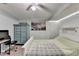 Cozy bedroom with brick accent wall, ceiling fan, and functional furniture at 639 Oak Moss Dr, Lawrenceville, GA 30043
