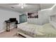 Cozy bedroom with brick accent wall, ceiling fan, and functional furniture at 639 Oak Moss Dr, Lawrenceville, GA 30043