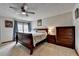 Comfortable bedroom with a queen-size bed, carpeted floor, and coordinating furniture at 639 Oak Moss Dr, Lawrenceville, GA 30043