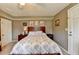 A cozy bedroom featuring a wooden bed frame and classic white door at 639 Oak Moss Dr, Lawrenceville, GA 30043