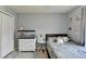 Inviting bedroom featuring soft bedding, minimalist decor, neutral tones, and a closet at 639 Oak Moss Dr, Lawrenceville, GA 30043