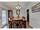 Elegant dining room with a large wooden table and stylish decor at 639 Oak Moss Dr, Lawrenceville, GA 30043