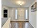 Bright foyer with hardwood floors, crisp white walls, and ample natural light streaming through the windows at 639 Oak Moss Dr, Lawrenceville, GA 30043
