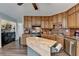 Spacious kitchen with wood cabinetry, stainless steel appliances, and a convenient kitchen island at 639 Oak Moss Dr, Lawrenceville, GA 30043