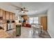 Open concept kitchen with wooden cabinets, stainless steel appliances, and a dining area at 639 Oak Moss Dr, Lawrenceville, GA 30043