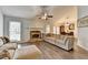 Inviting living room with a fireplace and hardwood floors, perfect for cozy evenings with Gathering and friends at 639 Oak Moss Dr, Lawrenceville, GA 30043