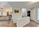 Spacious living room area with hardwood floors, seamlessly connecting to the dining area and living spaces at 639 Oak Moss Dr, Lawrenceville, GA 30043