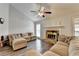 Bright living room with vaulted ceiling, neutral tones, and modern fan fixture at 639 Oak Moss Dr, Lawrenceville, GA 30043