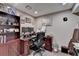 This home office features an executive desk, ample shelving, and neutral wall color at 639 Oak Moss Dr, Lawrenceville, GA 30043