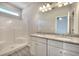 Bathroom with double sinks, granite countertops, vanity, walk-in shower, large mirror and vinyl floors at 266 Eva Ne Way, Cartersville, GA 30121