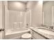 Bathroom featuring a shower-tub combo and a vanity with granite countertop and white cabinets at 266 Eva Ne Way, Cartersville, GA 30121