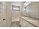 Bathroom with double sinks, granite countertops, vanity, walk-in shower, and vinyl floors at 266 Eva Ne Way, Cartersville, GA 30121