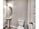 Half-bathroom with a white pedestal sink, a toilet, stylish flooring and neutral wall paint at 266 Eva Ne Way, Cartersville, GA 30121
