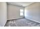 Bedroom with neutral walls, carpet, a window, and natural light for a cozy atmosphere at 266 Eva Ne Way, Cartersville, GA 30121