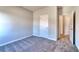Bright bedroom featuring neutral walls, carpeted floor, and access to a closet and the adjacent room at 266 Eva Ne Way, Cartersville, GA 30121