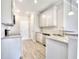 Modern kitchen with white cabinets, granite countertops, stainless steel appliances, and contemporary fixtures, designed for functionality at 266 Eva Ne Way, Cartersville, GA 30121