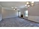 Bright and airy living space with a classic stone fireplace, complemented by modern lighting and neutral decor at 266 Eva Ne Way, Cartersville, GA 30121