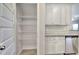 Walk-in pantry features white wire shelving providing ample storage space alongside kitchen at 266 Eva Ne Way, Cartersville, GA 30121