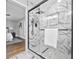 Sleek bathroom with a glass-enclosed shower, modern fixtures, and elegant marble tiling for a spa-like retreat at 276 Hermer Nw Cir, Atlanta, GA 30311