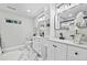 Luxurious bathroom with double sinks, modern fixtures, marble floors, and stylish decor, providing a spa-like experience at 276 Hermer Nw Cir, Atlanta, GA 30311