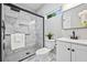 Stylish bathroom featuring a glass-enclosed shower with marble tiling, a modern vanity, and sleek fixtures at 276 Hermer Nw Cir, Atlanta, GA 30311