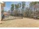 Fenced backyard backs to wooded area and offers shade at 3452 Village Park Sw Ln, Atlanta, GA 30331