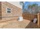 A Generac generator for reliable backup power, enclosed by a wooden fence at 3452 Village Park Sw Ln, Atlanta, GA 30331