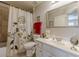 Bright bathroom featuring a shower with tile surround and a white vanity at 3452 Village Park Sw Ln, Atlanta, GA 30331