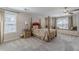 Traditional bedroom with large windows and a built in bench seat at 3452 Village Park Sw Ln, Atlanta, GA 30331