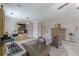 Primary bedroom featuring sitting area, large screen TV, and light gray walls at 3452 Village Park Sw Ln, Atlanta, GA 30331