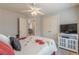 Relaxing bedroom includes a ceiling fan, a double closet, and a convenient TV at 3452 Village Park Sw Ln, Atlanta, GA 30331