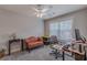 Bedroom featuring a ceiling fan and large window at 3452 Village Park Sw Ln, Atlanta, GA 30331