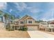 Inviting two-story home with stone accents, attached garage, and lovely curb appeal at 3452 Village Park Sw Ln, Atlanta, GA 30331