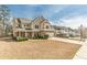 Beautiful two-story home with well-manicured landscaping and a long driveway in a suburban neighborhood at 3452 Village Park Sw Ln, Atlanta, GA 30331