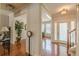 Spacious foyer with hardwood floors, and natural light provides a welcoming entry into the home at 3452 Village Park Sw Ln, Atlanta, GA 30331