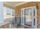 Inviting front porch with stone accents and cozy seating, ideal for enjoying the neighborhood at 3452 Village Park Sw Ln, Atlanta, GA 30331