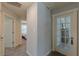 Hallway with carpet flooring and natural light streaming from an open bedroom at 3452 Village Park Sw Ln, Atlanta, GA 30331