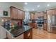 Well-equipped kitchen featuring stainless appliances, wood cabinetry, granite countertops, and ample counter space at 3452 Village Park Sw Ln, Atlanta, GA 30331