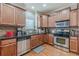 Updated kitchen boasts stainless steel appliances, wood cabinets, and a functional layout at 3452 Village Park Sw Ln, Atlanta, GA 30331