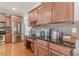 Functional kitchen with stainless steel appliances, custom wood cabinets, and granite countertops at 3452 Village Park Sw Ln, Atlanta, GA 30331