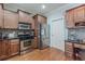 Spacious kitchen featuring stainless steel appliances, wooden cabinetry, and a functional design at 3452 Village Park Sw Ln, Atlanta, GA 30331