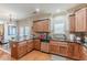 Bright kitchen featuring wooden cabinets, granite countertops, stainless steel appliances, and a breakfast bar at 3452 Village Park Sw Ln, Atlanta, GA 30331