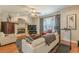 Cozy living room features a fireplace, plush seating, and ample natural light at 3452 Village Park Sw Ln, Atlanta, GA 30331